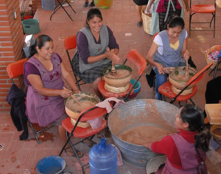 Woman whipping atole cacao